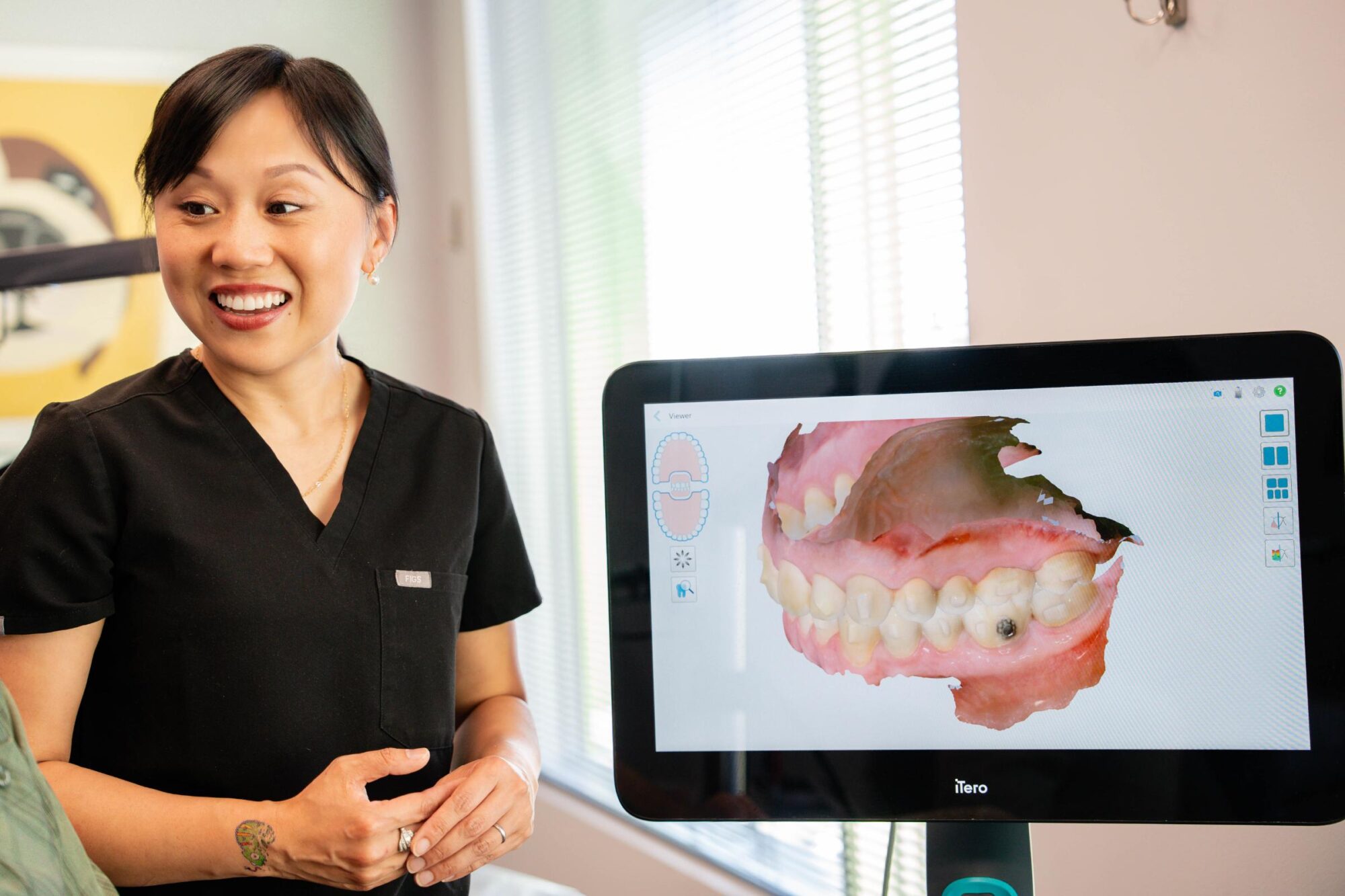 team member looking at orthodontic scans