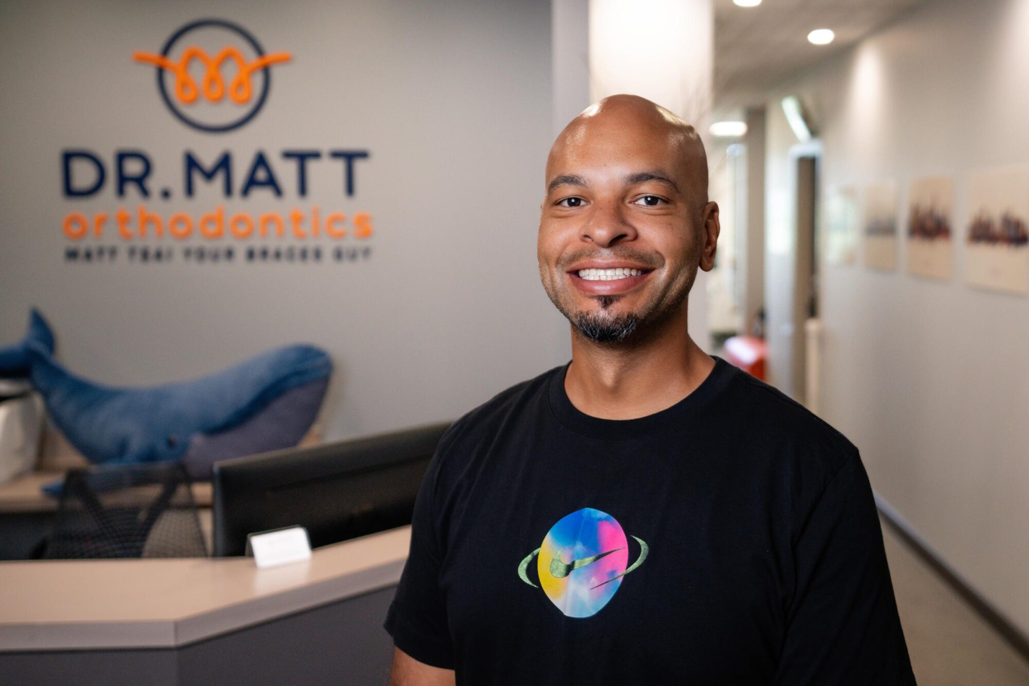 Adult patient smiling after orthodontic treatment at Dr. Matt Orthodontics in Beaverton