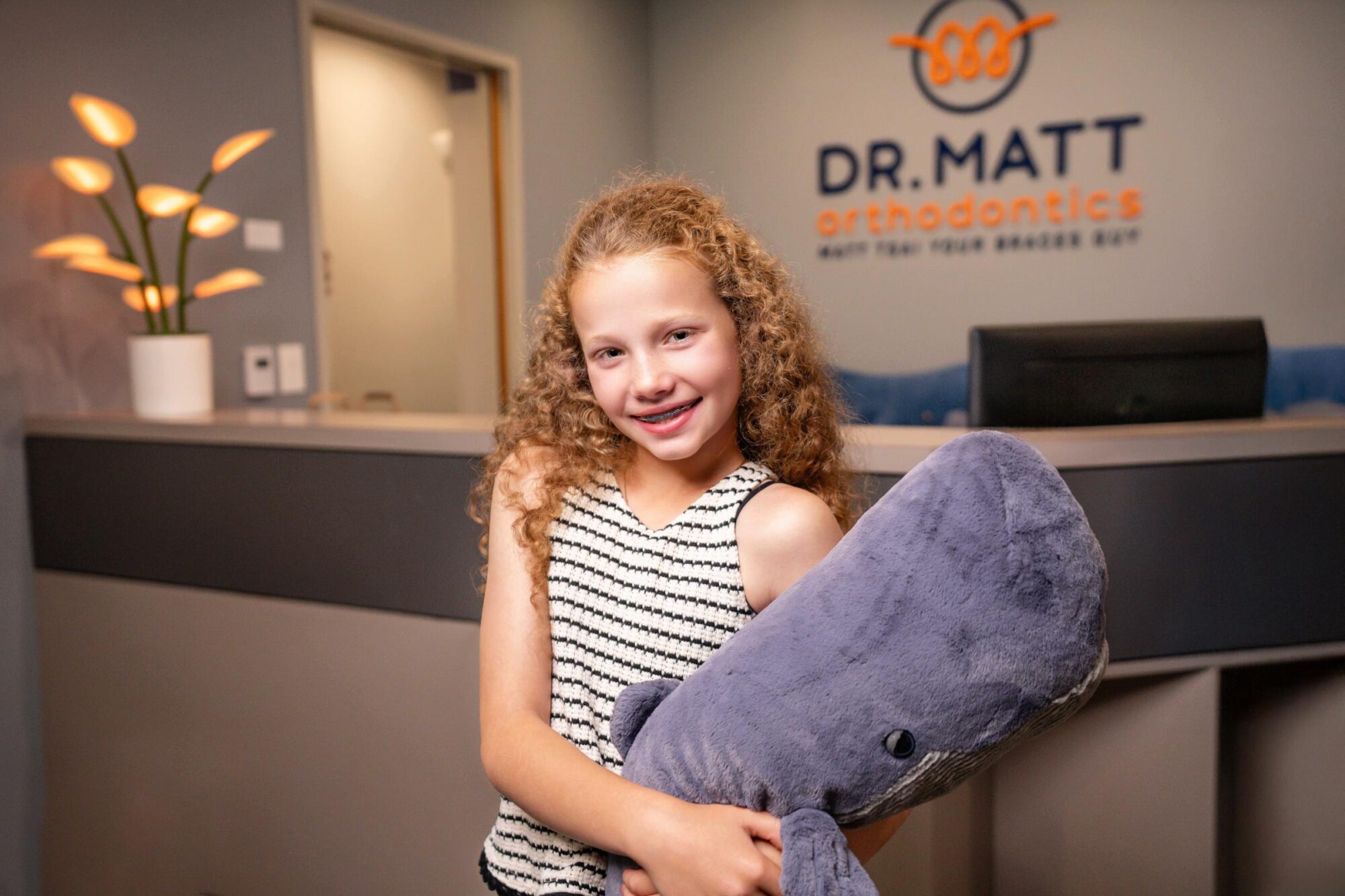 Child smiling during early orthodontic evaluation at Dr. Matt Orthodontics in Beaverton